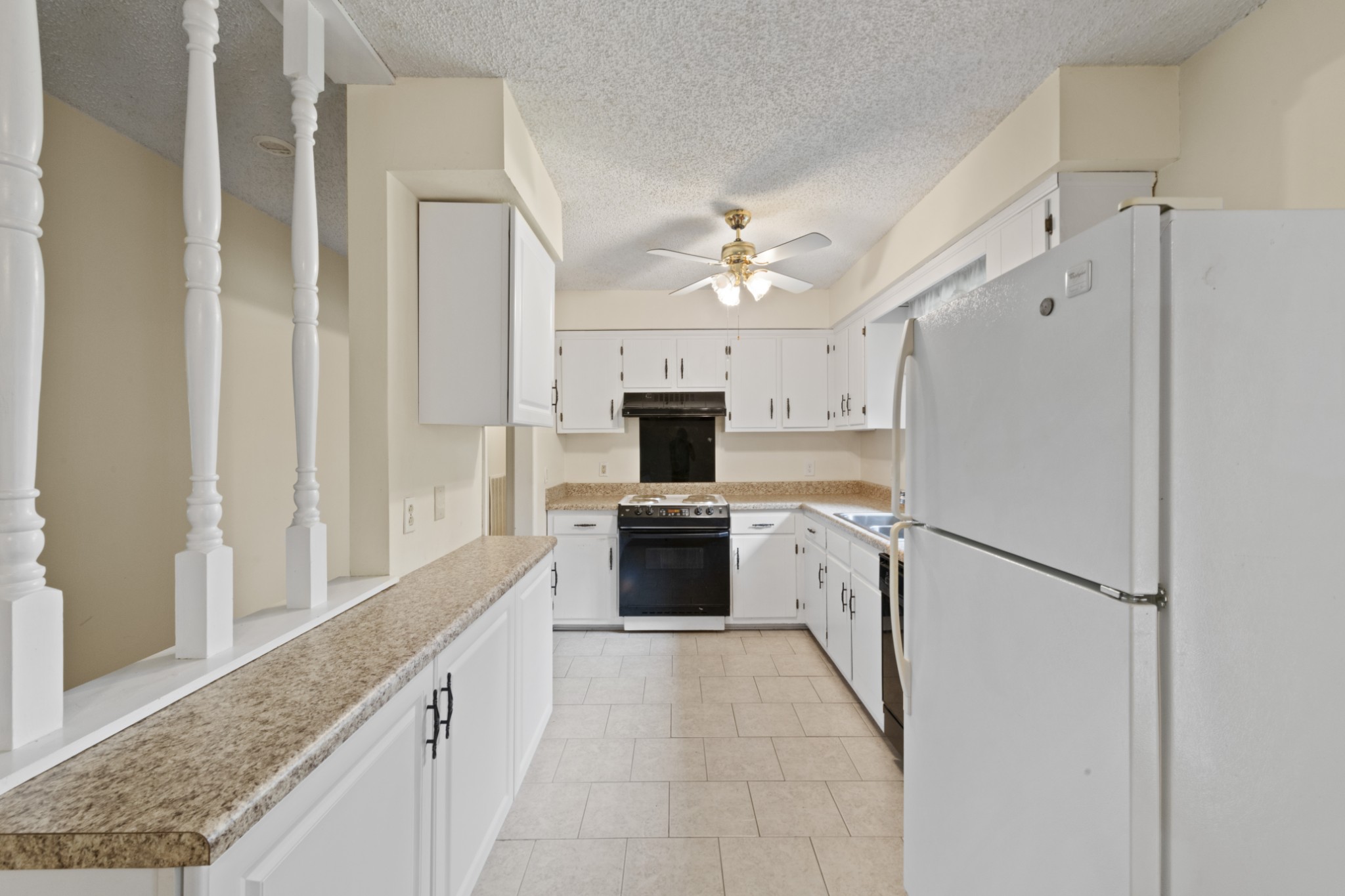 357 Raymond Hodges Road Cottontown, TN 37048 - Photo 8 of 21 a kitchen with a refrigerator and a stove