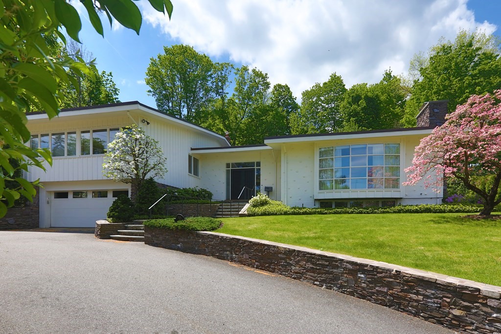 55 Chestnut Hill Road Newton, MA 02467 - Photo 1 of 21 a front view of a house with garden