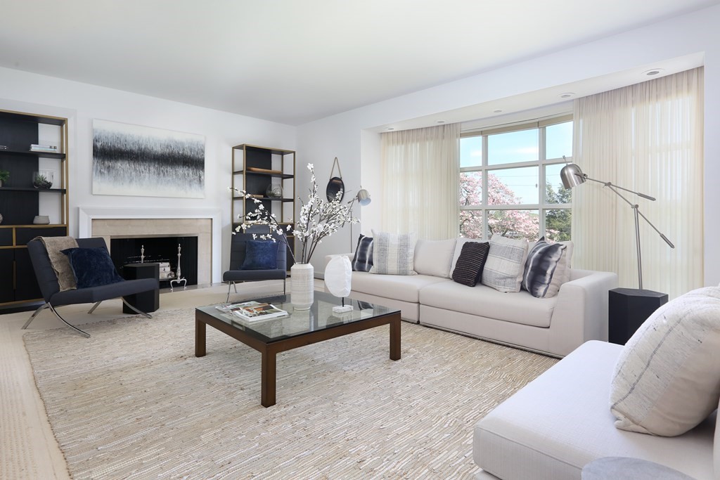 55 Chestnut Hill Road Newton, MA 02467 - Photo 2 of 21 a living room with furniture a fireplace and a table