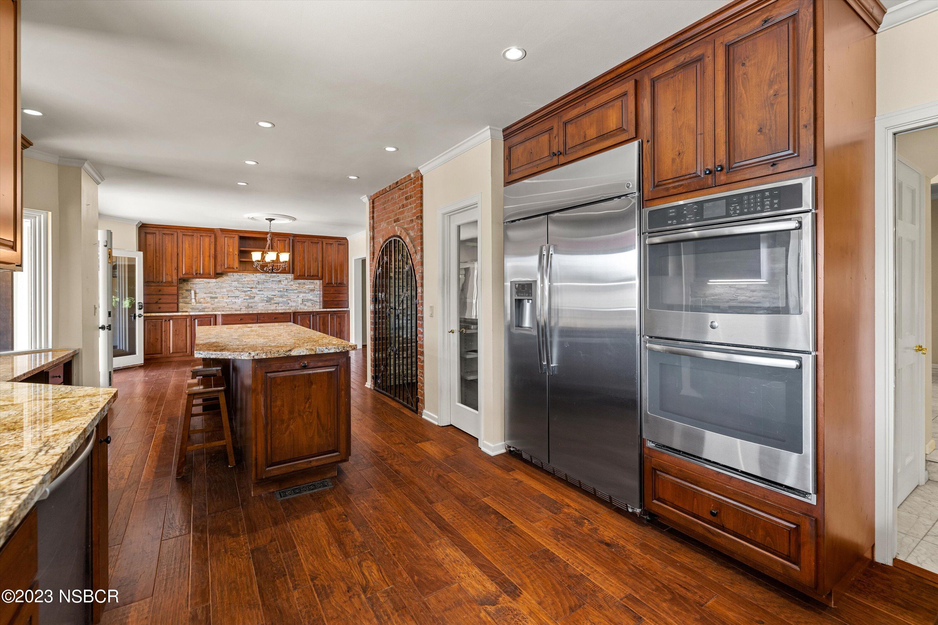 345 Meadowlark Road Santa Ynez, CA 93460 - Photo 14 of 57 a kitchen with stainless steel appliances granite countertop a refrigerator a stove and a sink