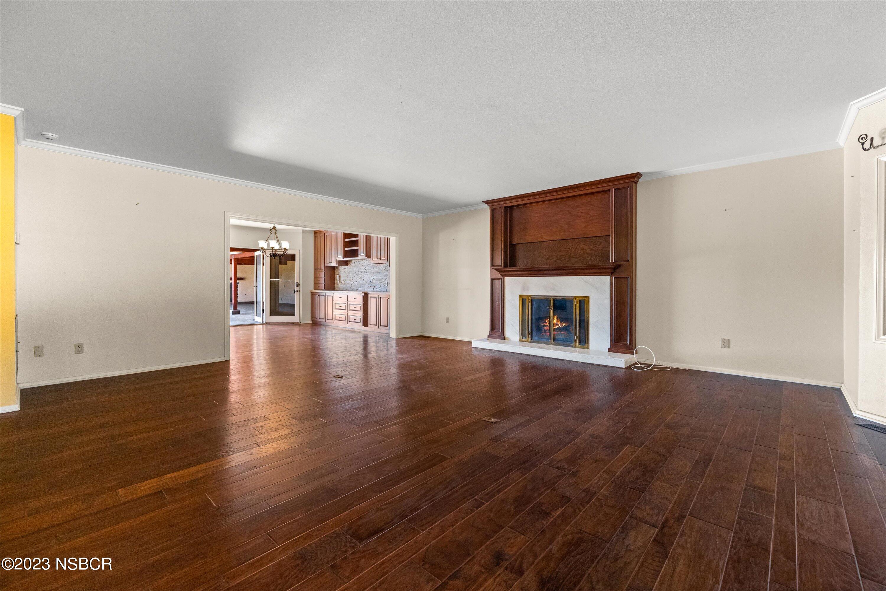 345 Meadowlark Road Santa Ynez, CA 93460 - Photo 19 of 57 a view of an empty room with wooden floor and a window