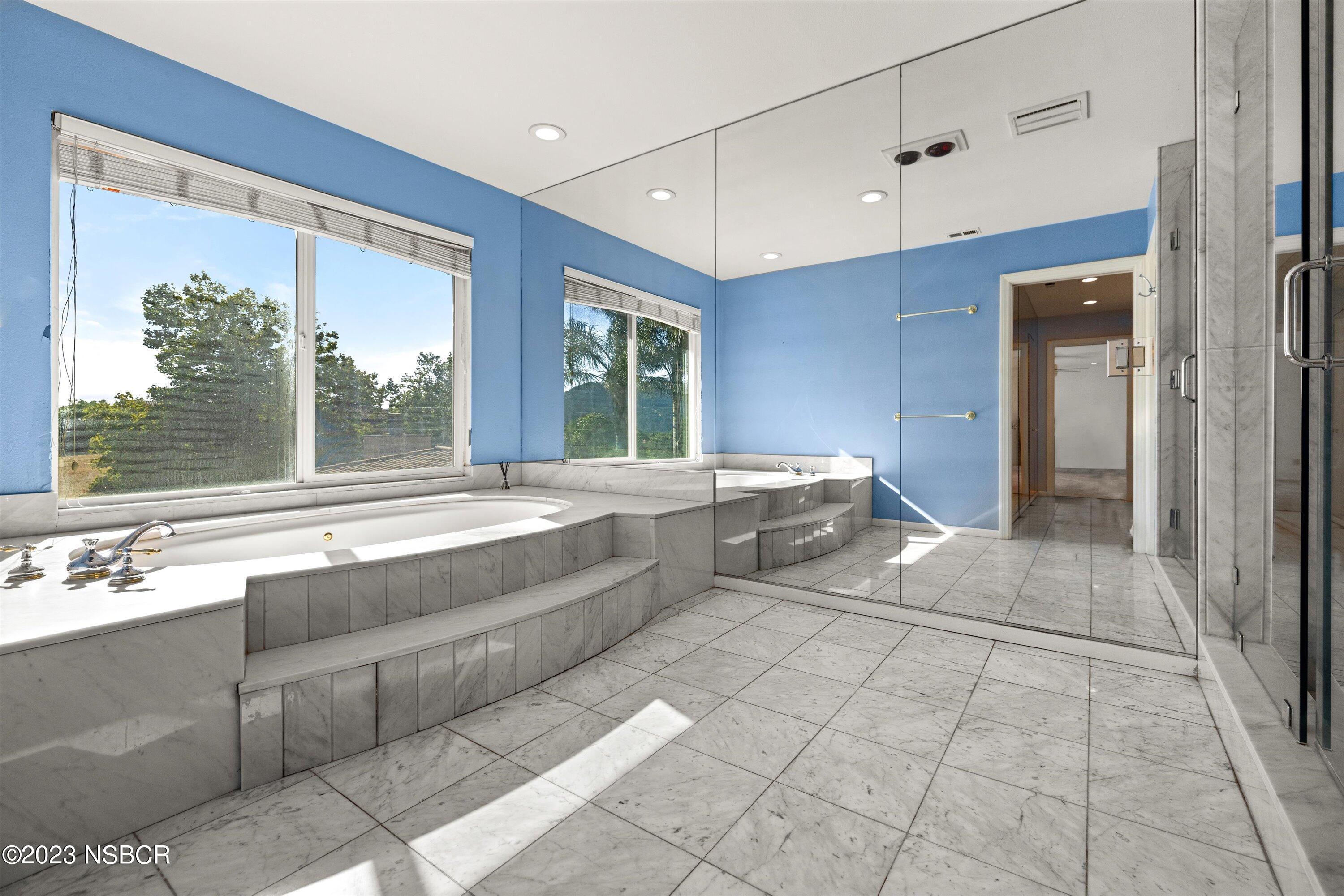 345 Meadowlark Road Santa Ynez, CA 93460 - Photo 25 of 57 a spacious bathroom with a tub sink and mirror