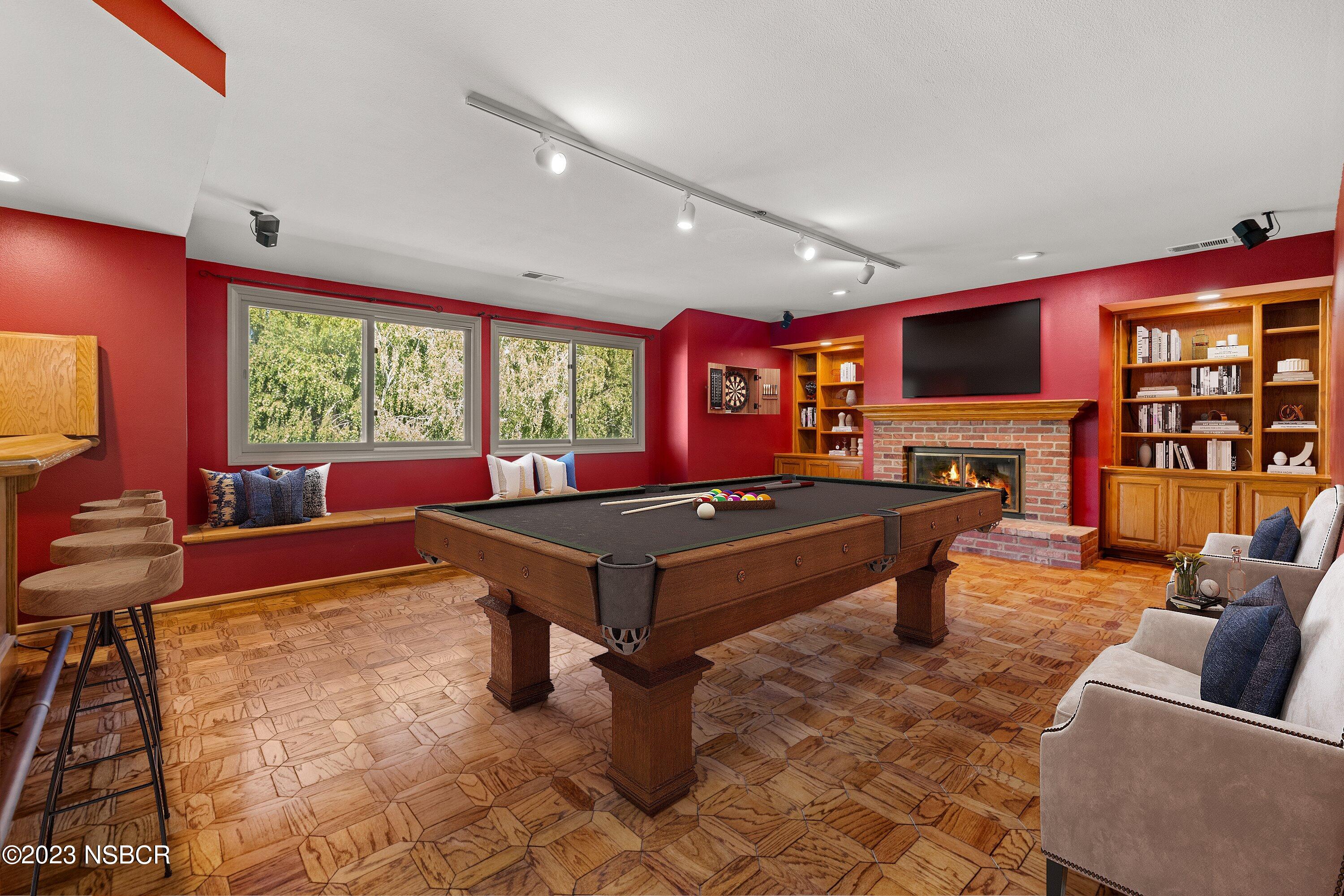 345 Meadowlark Road Santa Ynez, CA 93460 - Photo 30 of 57 a living room with furniture a flat screen tv and floor to ceiling window
