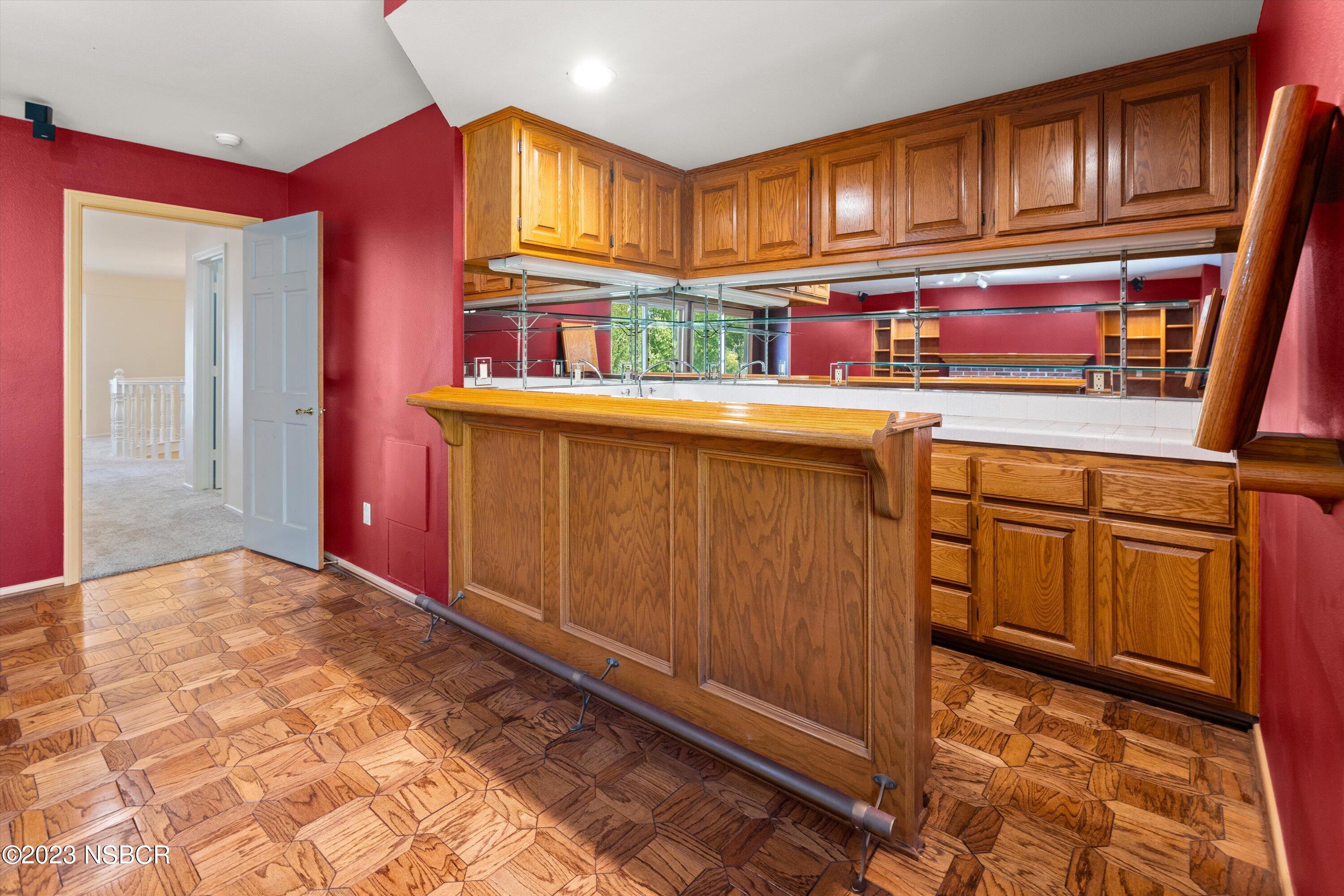 345 Meadowlark Road Santa Ynez, CA 93460 - Photo 32 of 57 a kitchen with stainless steel appliances granite countertop a refrigerator and cabinets