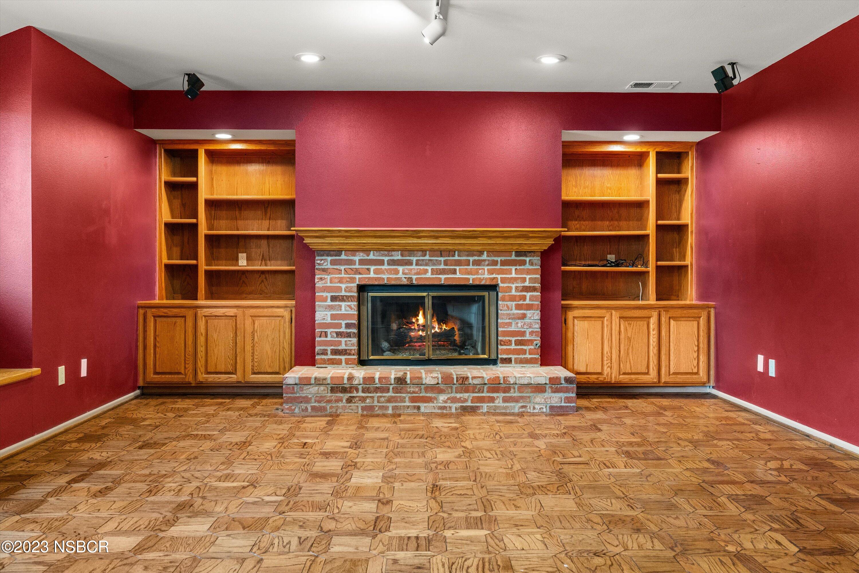 345 Meadowlark Road Santa Ynez, CA 93460 - Photo 33 of 57 a view of a livingroom with a fireplace and workspace