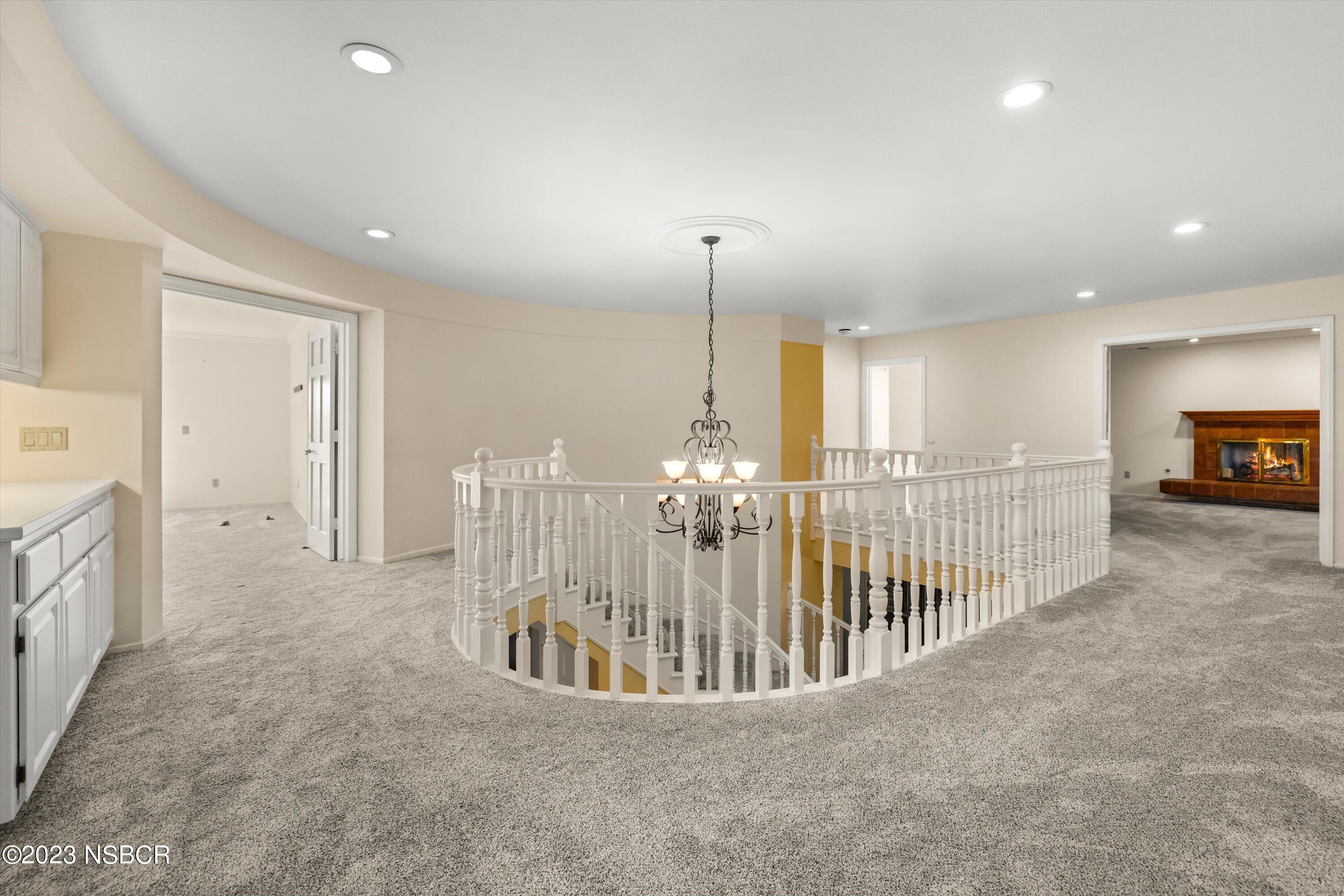 345 Meadowlark Road Santa Ynez, CA 93460 - Photo 34 of 57 a view of a hallway with chandelier