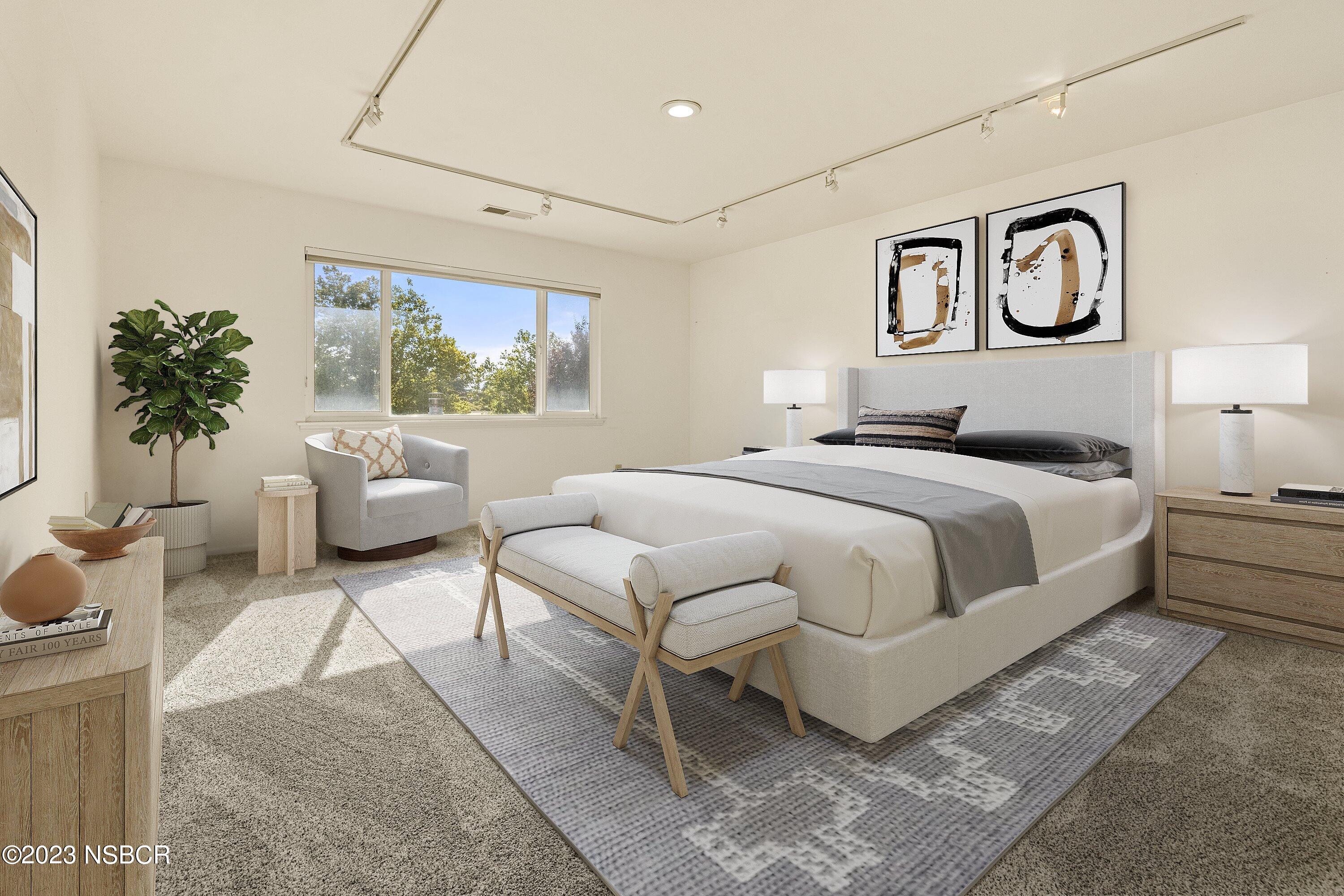 345 Meadowlark Road Santa Ynez, CA 93460 - Photo 37 of 57 a bedroom with a large bed and a painting on the wall