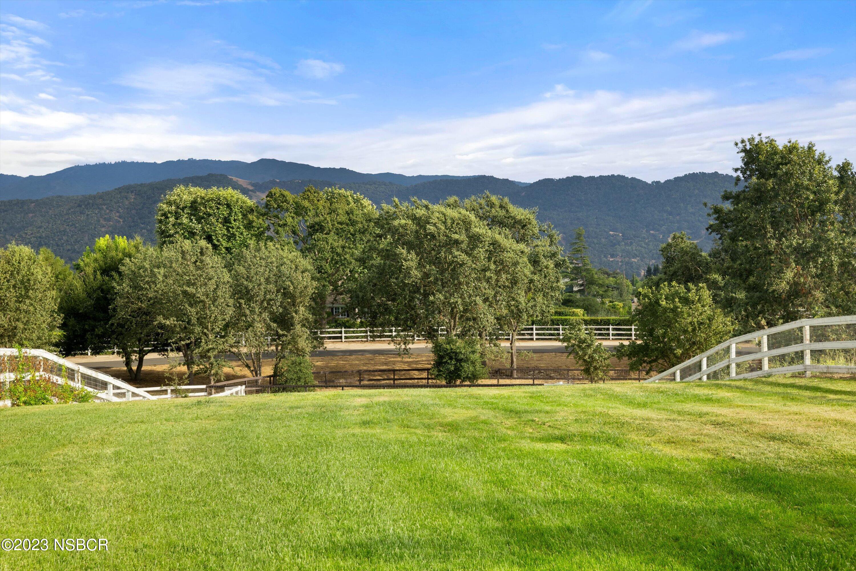 345 Meadowlark Road Santa Ynez, CA 93460 - Photo 44 of 57 a view of a house with a big yard
