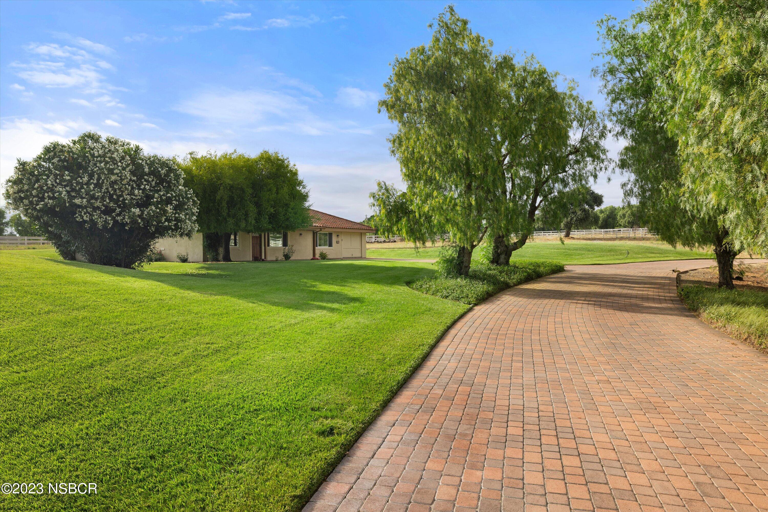 345 Meadowlark Road Santa Ynez, CA 93460 - Photo 46 of 57 a view of a backyard with green space