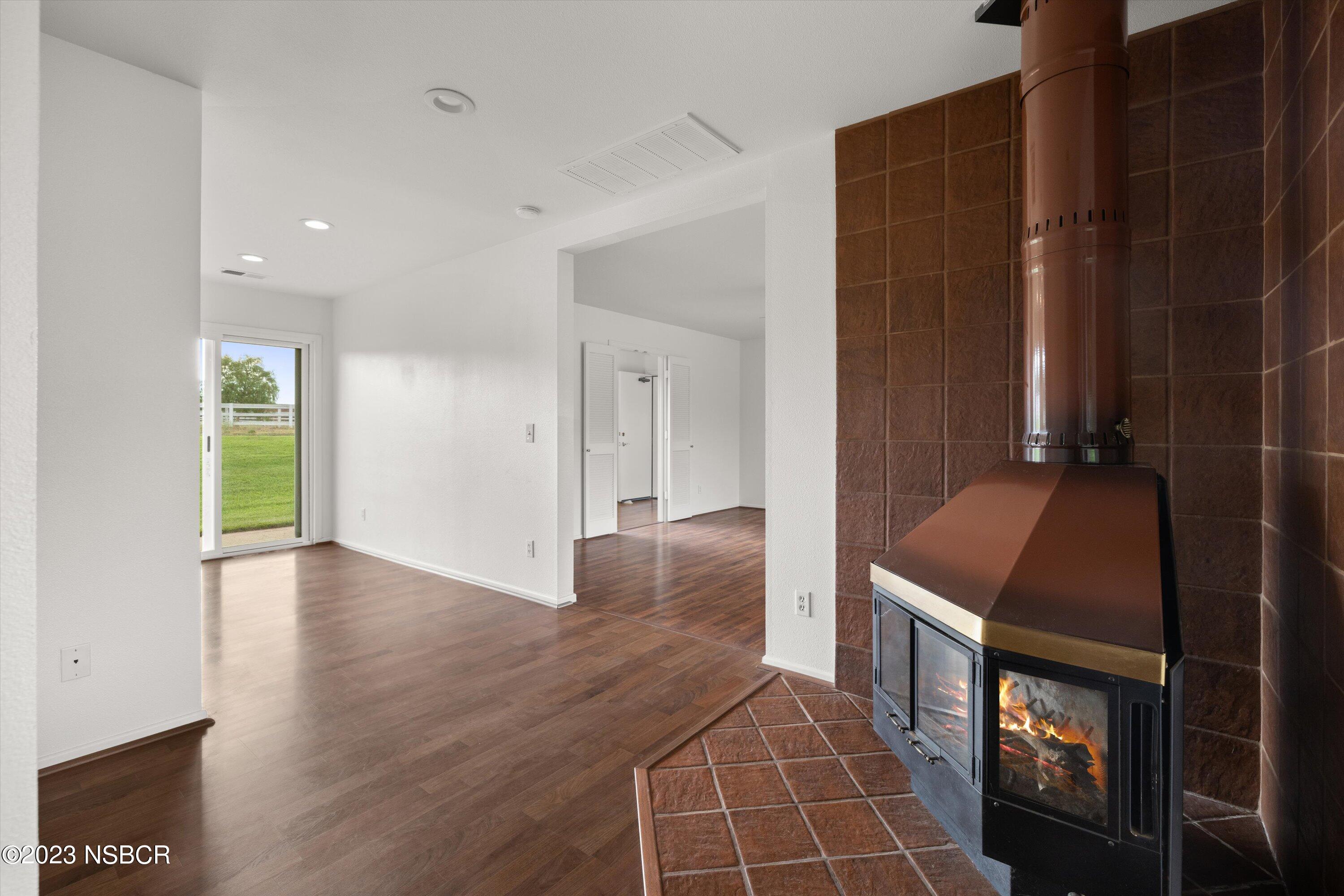 345 Meadowlark Road Santa Ynez, CA 93460 - Photo 48 of 57 a view of an empty room with wooden floor and a bathroom