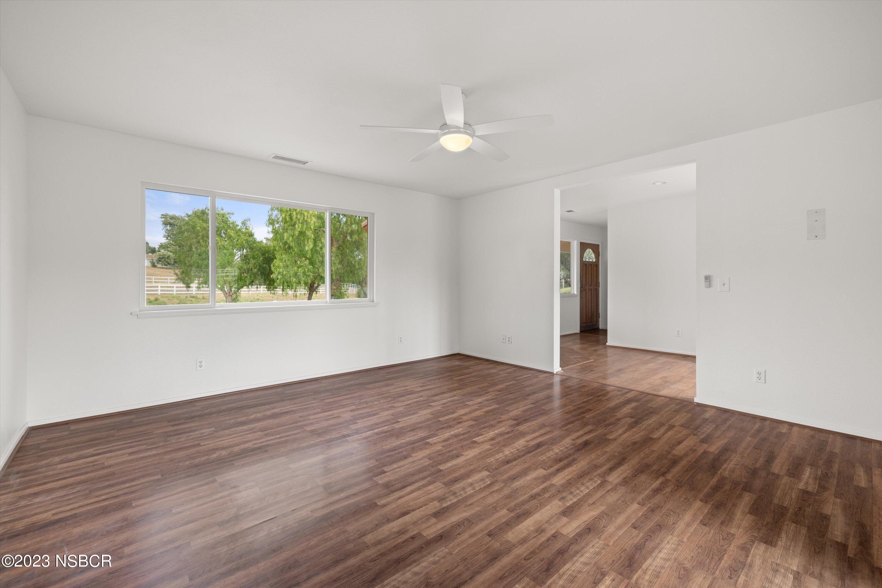 345 Meadowlark Road Santa Ynez, CA 93460 - Photo 51 of 57 a view of an empty room with wooden floor and a window
