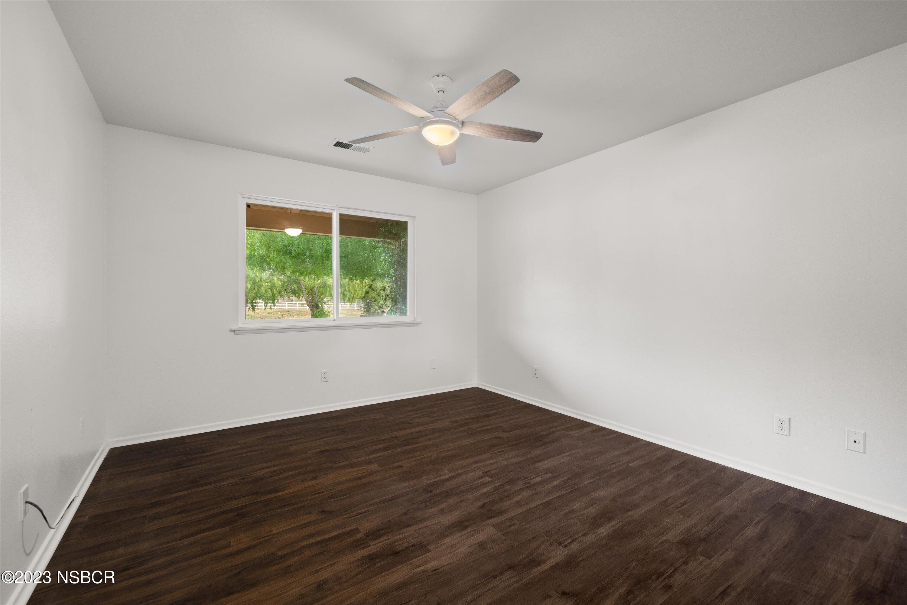 345 Meadowlark Road Santa Ynez, CA 93460 - Photo 53 of 57 wooden floor in an empty room with a window