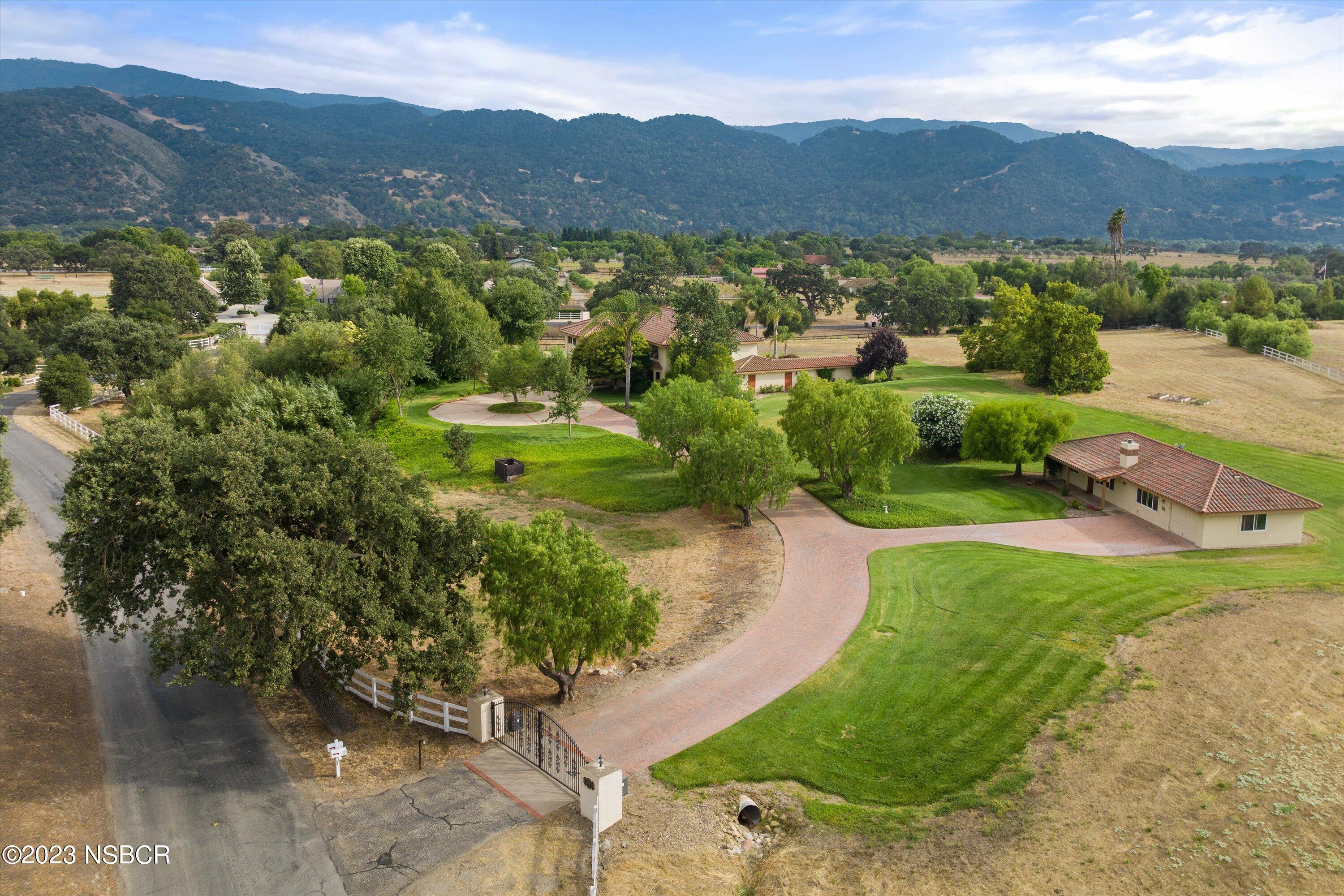345 Meadowlark Road Santa Ynez, CA 93460 - Photo 55 of 57 a view of a lush green hillside and houses