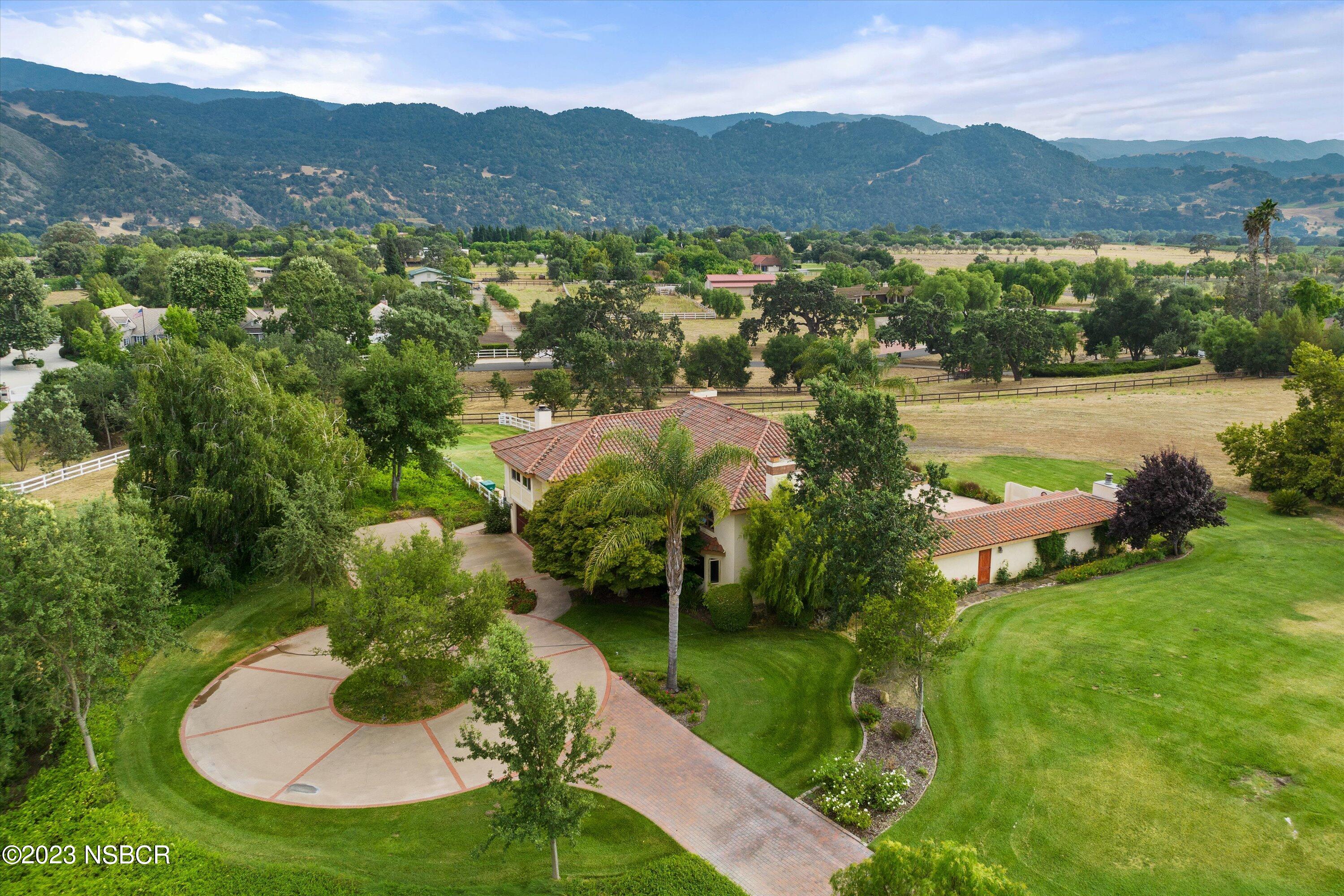 345 Meadowlark Road Santa Ynez, CA 93460 - Photo 56 of 57 a view of a lake with a mountain in the background