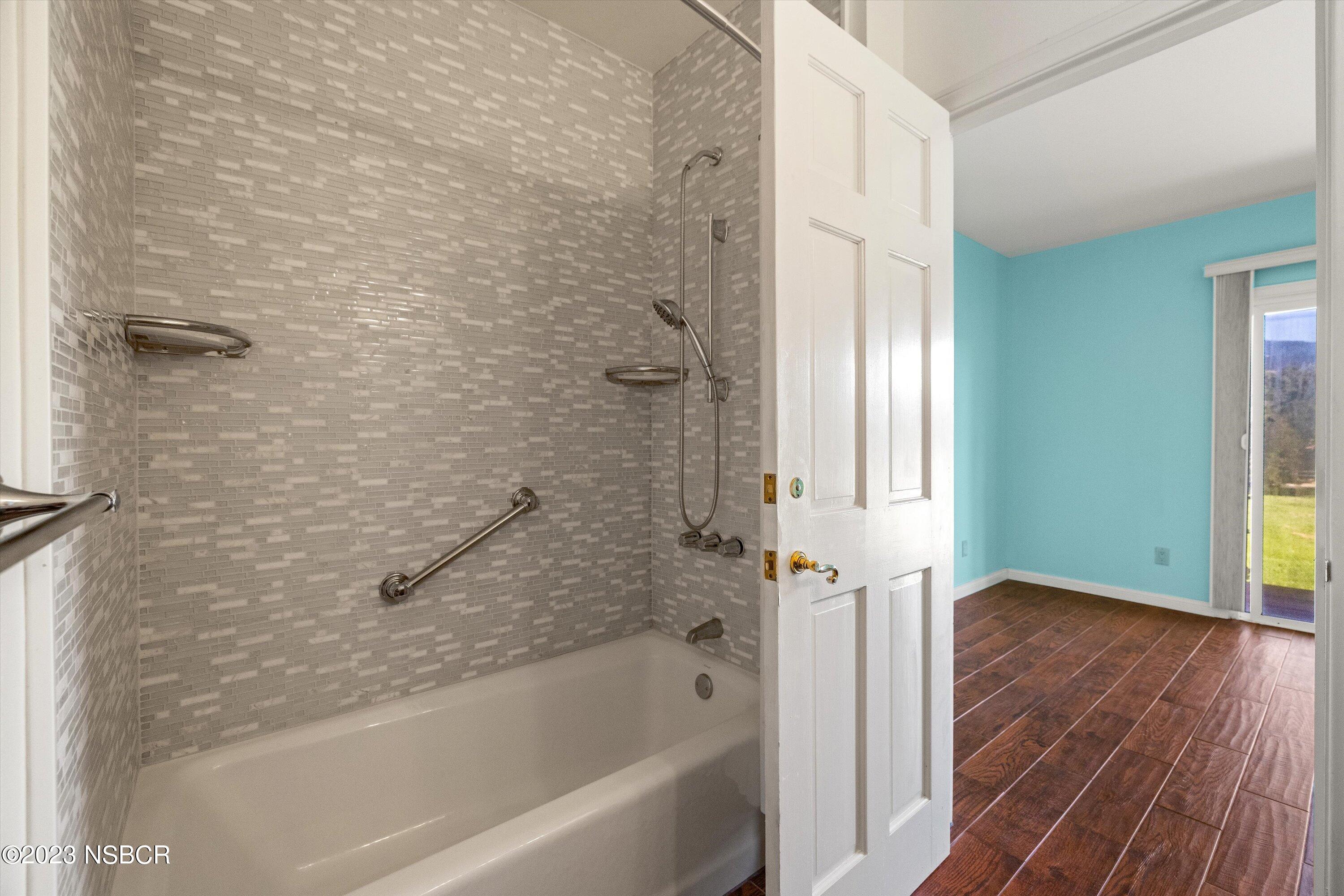 345 Meadowlark Road Santa Ynez, CA 93460 - Photo 9 of 57 a bathroom with a bathtub and a shower