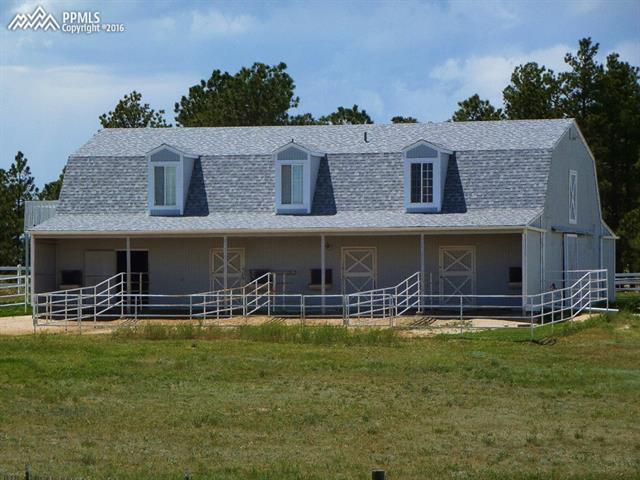 15750 Spur Ranch Road Peyton, CO 80831 - Photo 2 of 3 Stable with guest quarters on upper level
