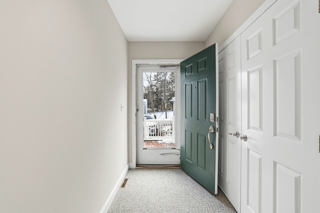 74 Branch Street, Unit 15 Scituate, MA 02066 - Photo 5 of 26 a view of a hallway with windows
