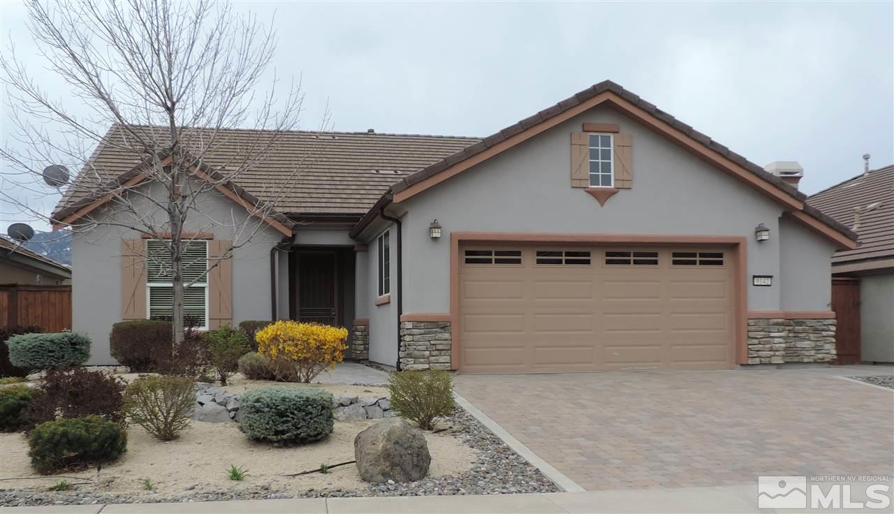 9142 Mount Pleasant Drive Reno, NV 89523 - Photo 1 of 34 a front view of a house with a yard and garage
