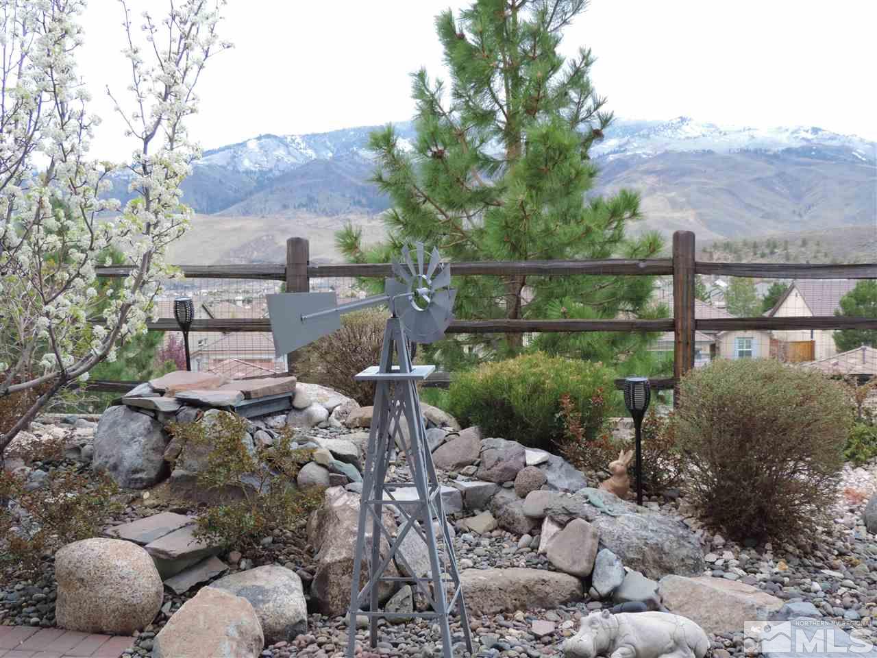 9142 Mount Pleasant Drive Reno, NV 89523 - Photo 16 of 34 a view of a garden with a mountain in the background