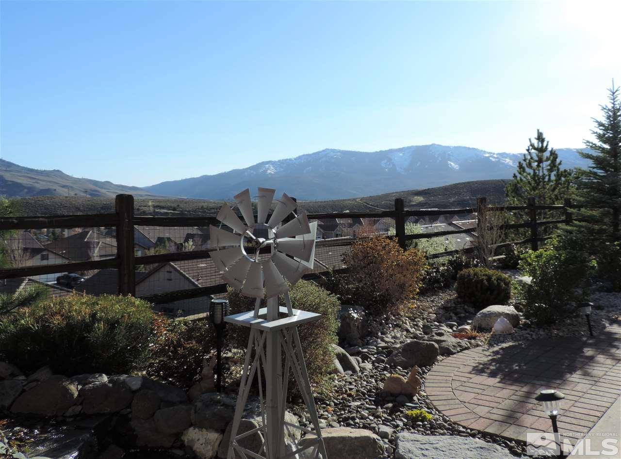 9142 Mount Pleasant Drive Reno, NV 89523 - Photo 2 of 34 a view of a house with a yard and mountain view in back
