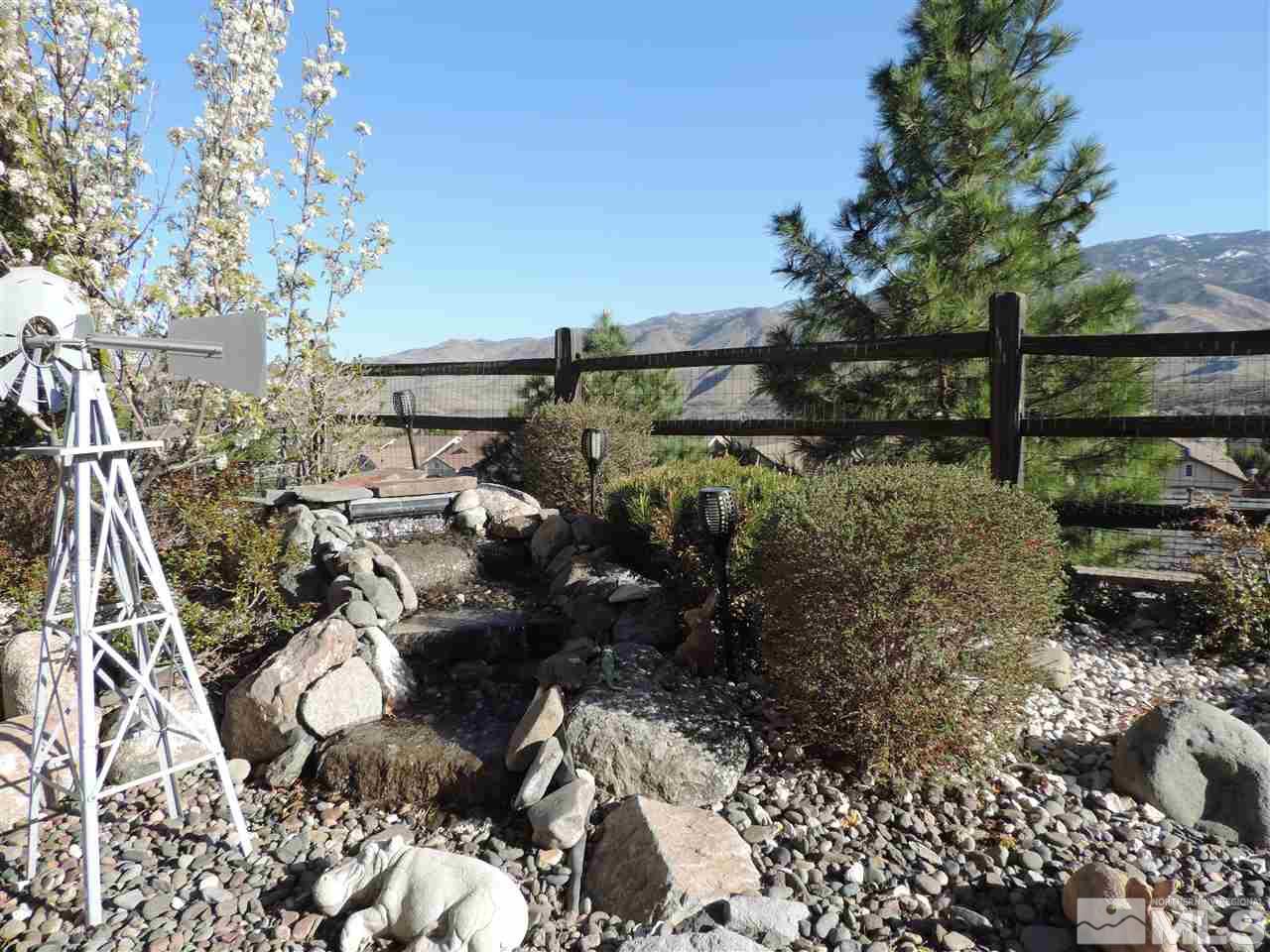 9142 Mount Pleasant Drive Reno, NV 89523 - Photo 3 of 34 a backyard of a house with lots of green space