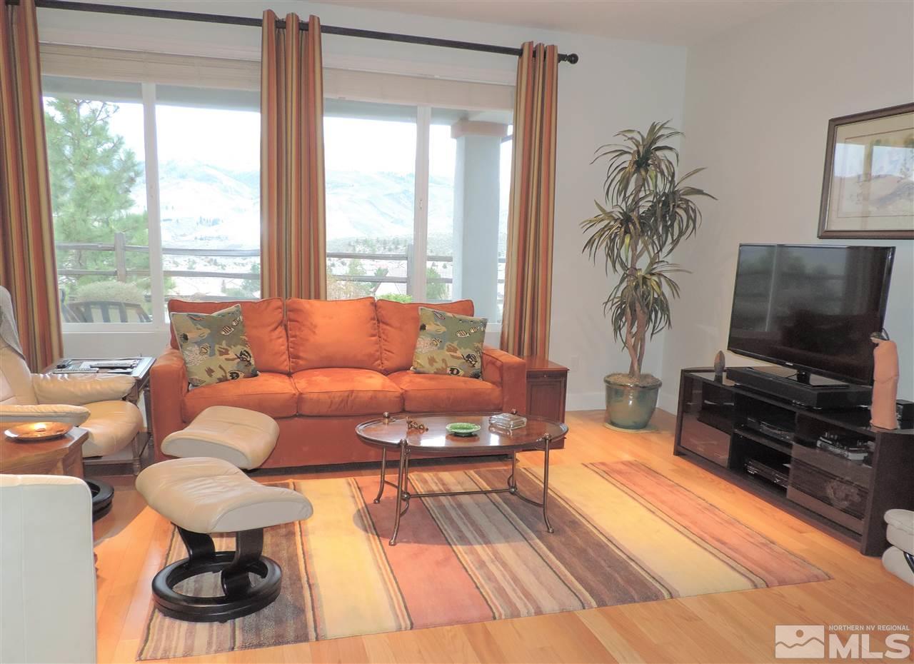 9142 Mount Pleasant Drive Reno, NV 89523 - Photo 5 of 34 a living room with furniture and a flat screen tv