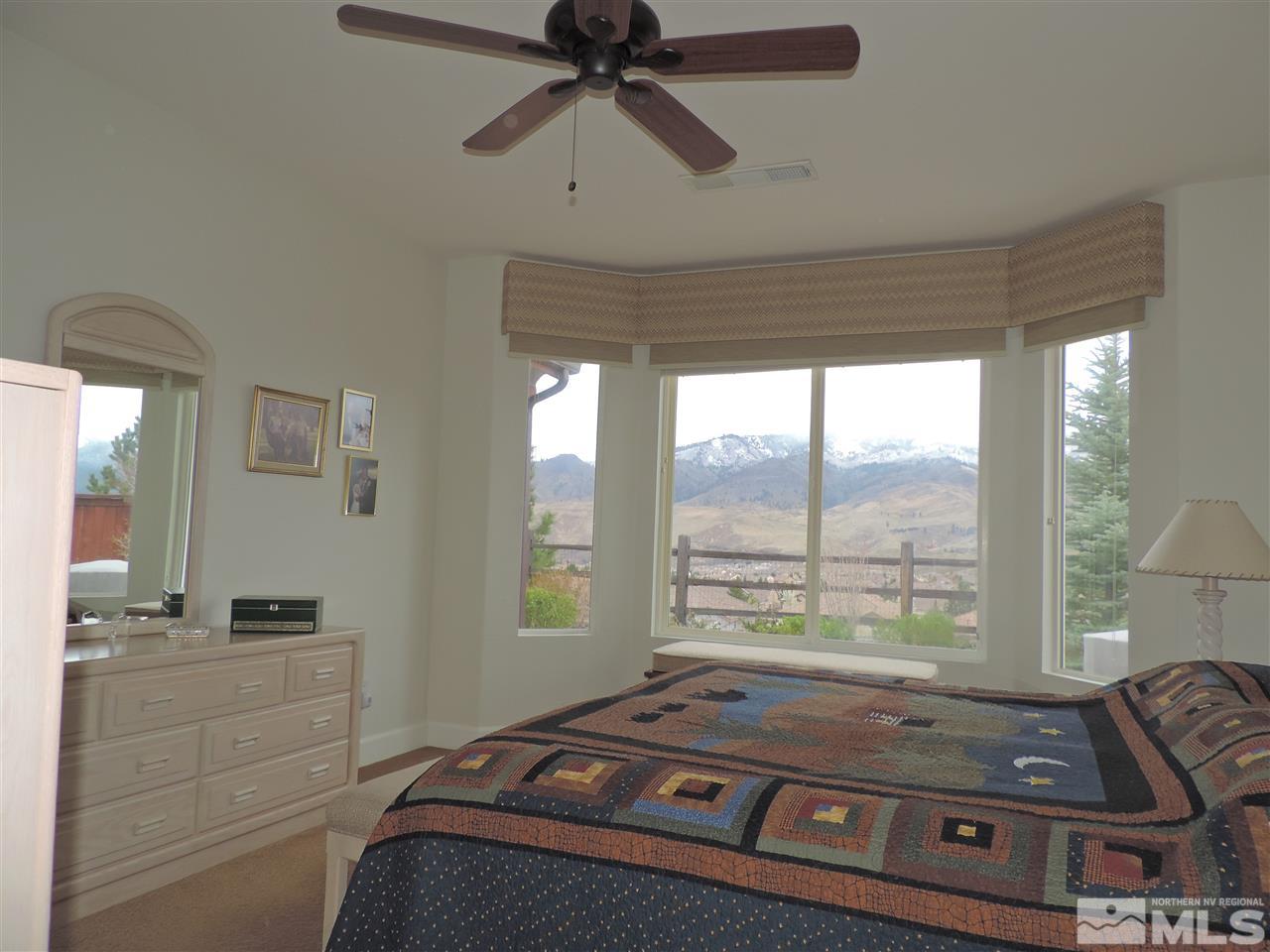 9142 Mount Pleasant Drive Reno, NV 89523 - Photo 9 of 34 a room with a bed and a window