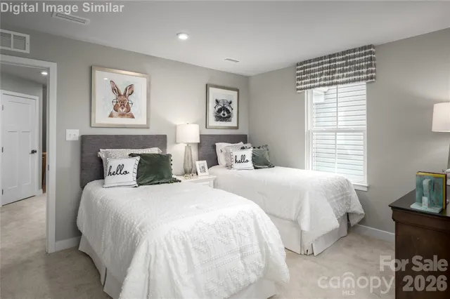 a bedroom with double bed and a window