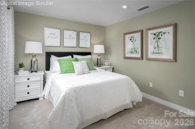 a bedroom with a bed and a night stand