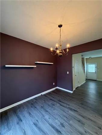 a view of a livingroom with wooden floor