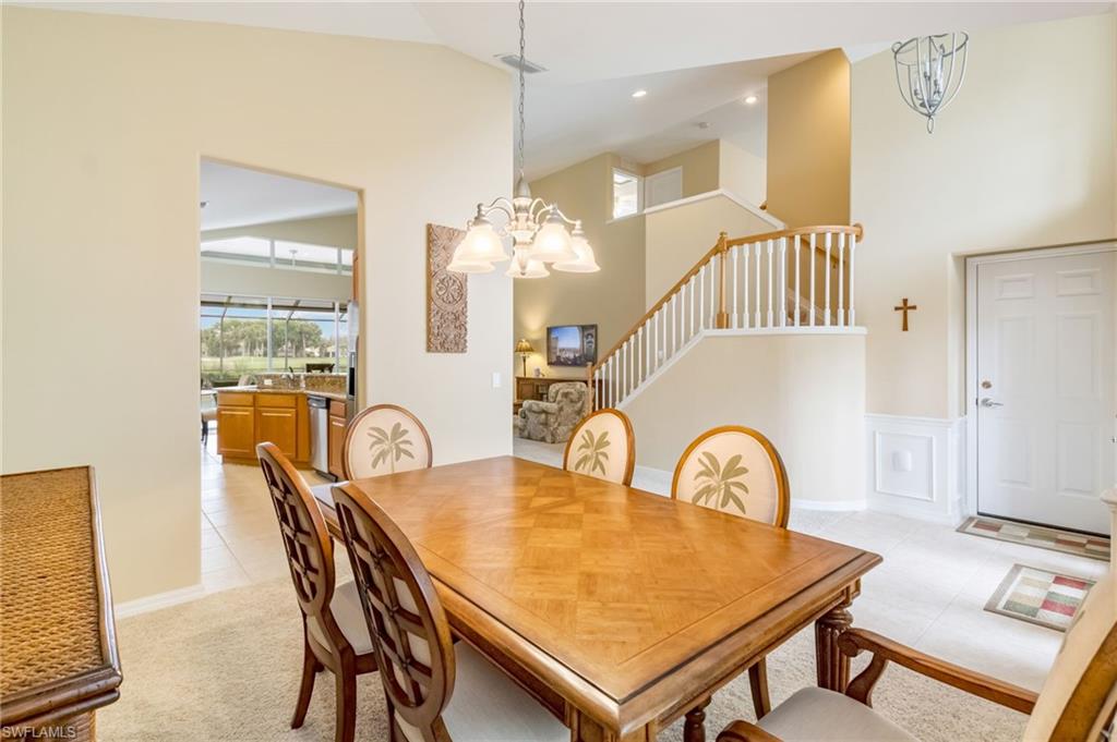 5857 Constitution Street Ave Maria, FL 34142 - Photo 11 of 40 a dining room with furniture and window
