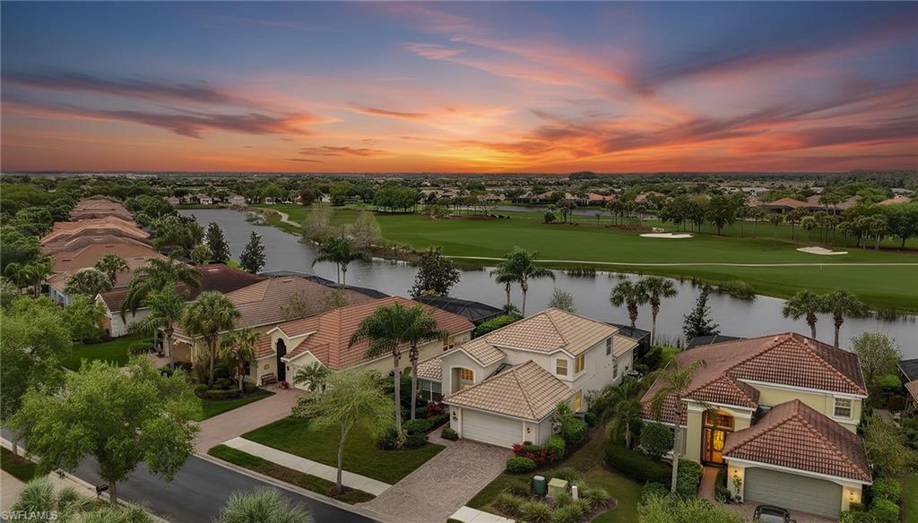 5857 Constitution Street Ave Maria, FL 34142 - Photo 2 of 40 an aerial view of a house with outdoor space and lake view