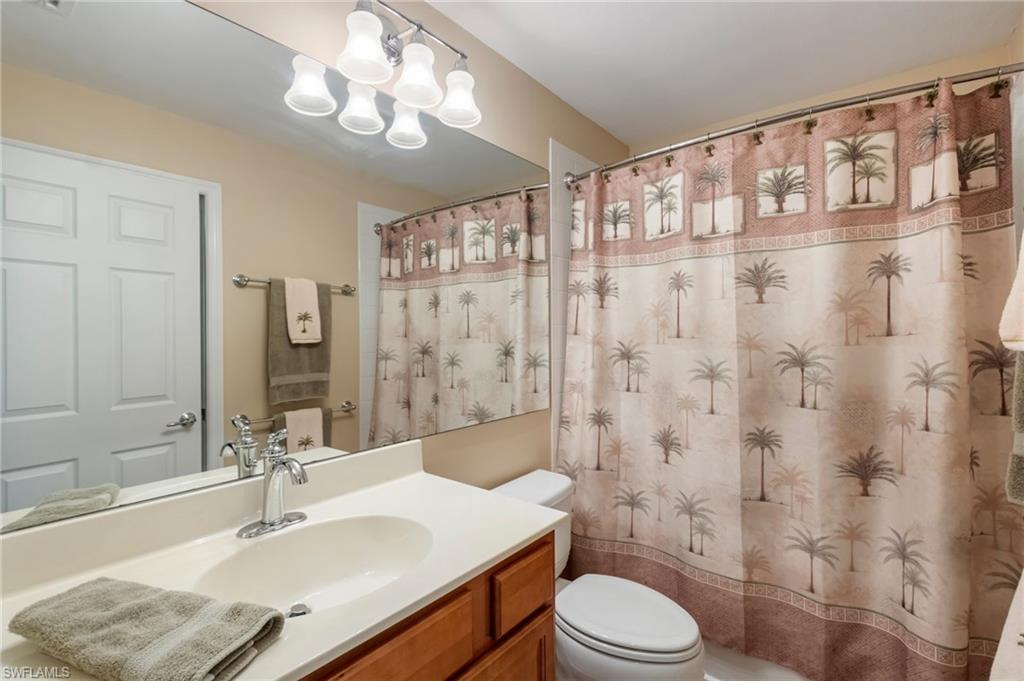 5857 Constitution Street Ave Maria, FL 34142 - Photo 21 of 40 a bathroom with a sink toilet a mirror and shower