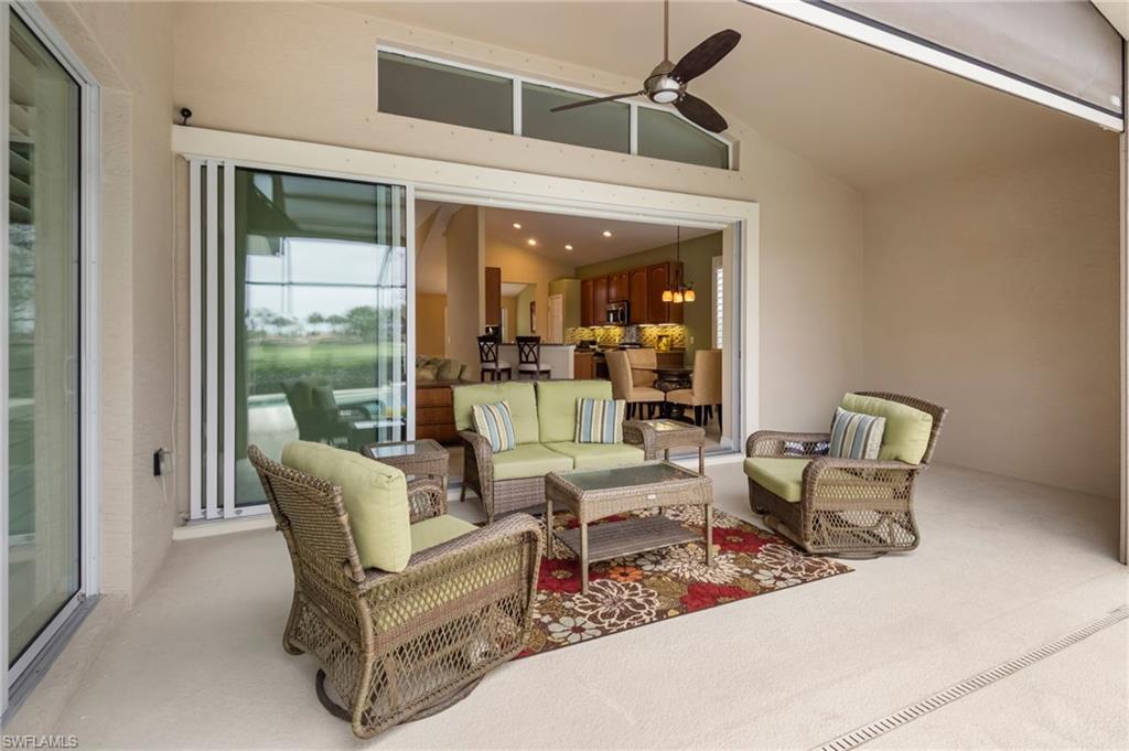 5857 Constitution Street Ave Maria, FL 34142 - Photo 22 of 40 a living room with furniture and large windows