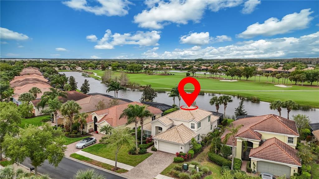 5857 Constitution Street Ave Maria, FL 34142 - Photo 3 of 40 an aerial view of a house with outdoor space and lake view