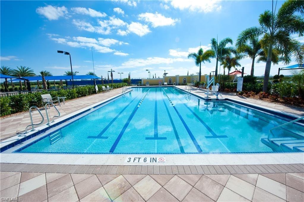 5857 Constitution Street Ave Maria, FL 34142 - Photo 33 of 40 a view of swimming pool with a lounge chair and palm trees