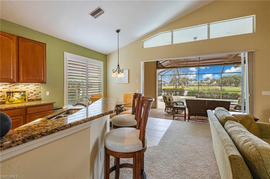 5857 Constitution Street Ave Maria, FL 34142 - Photo 7 of 40 a living room with furniture and a large window