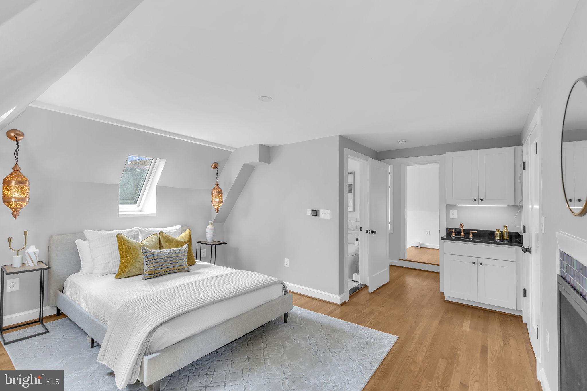 8603 Cedar Street Silver Spring, MD 20910 - Photo 14 of 46 a bedroom with a bed and a flat screen tv