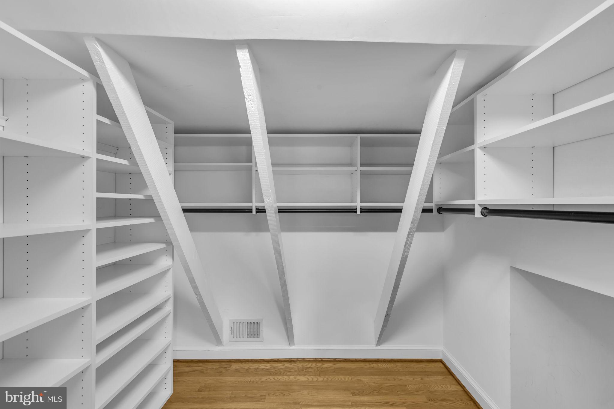 8603 Cedar Street Silver Spring, MD 20910 - Photo 16 of 46 a view of walk in closet with empty racks