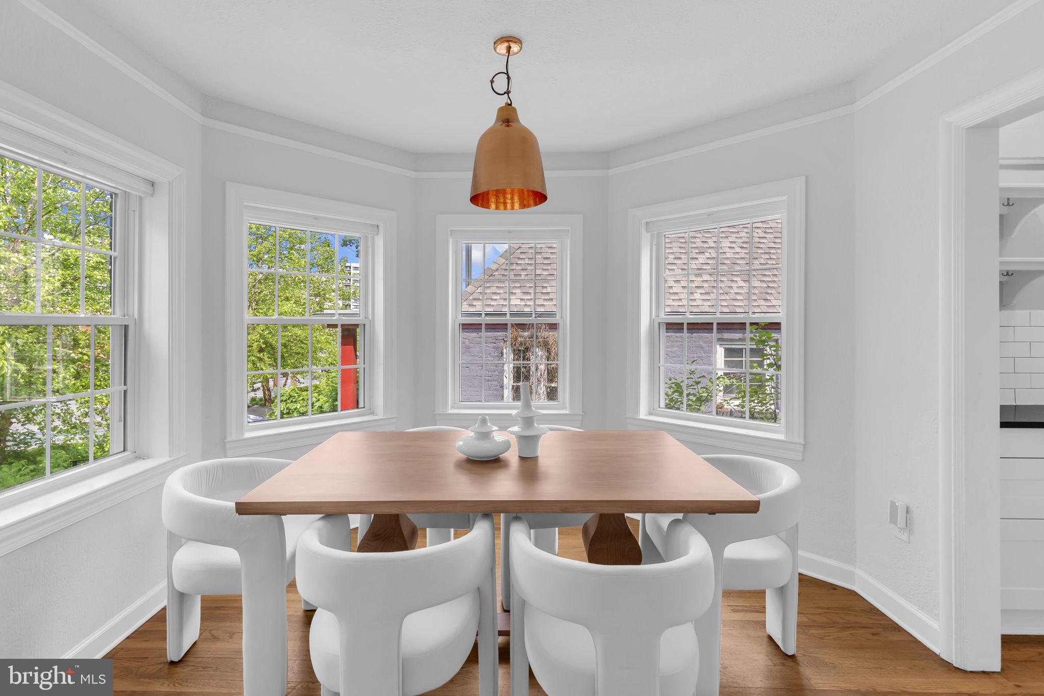 8603 Cedar Street Silver Spring, MD 20910 - Photo 7 of 46 a view of a dining room with furniture window and wooden floor