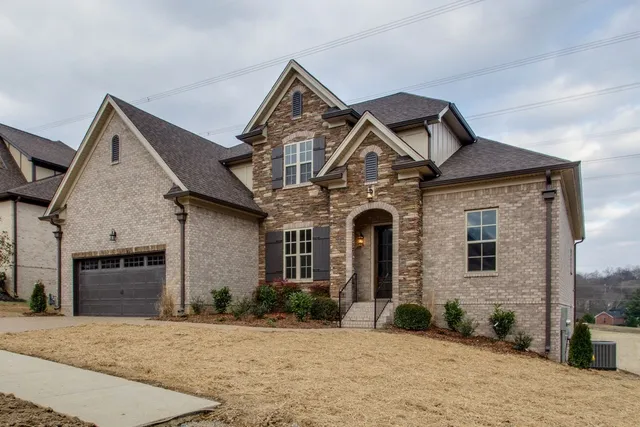 front view of a house with a yard