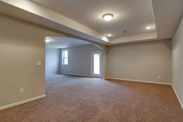 a view of a house with backyard and porch