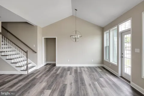 a bathroom with a double vanity sink mirror and shower