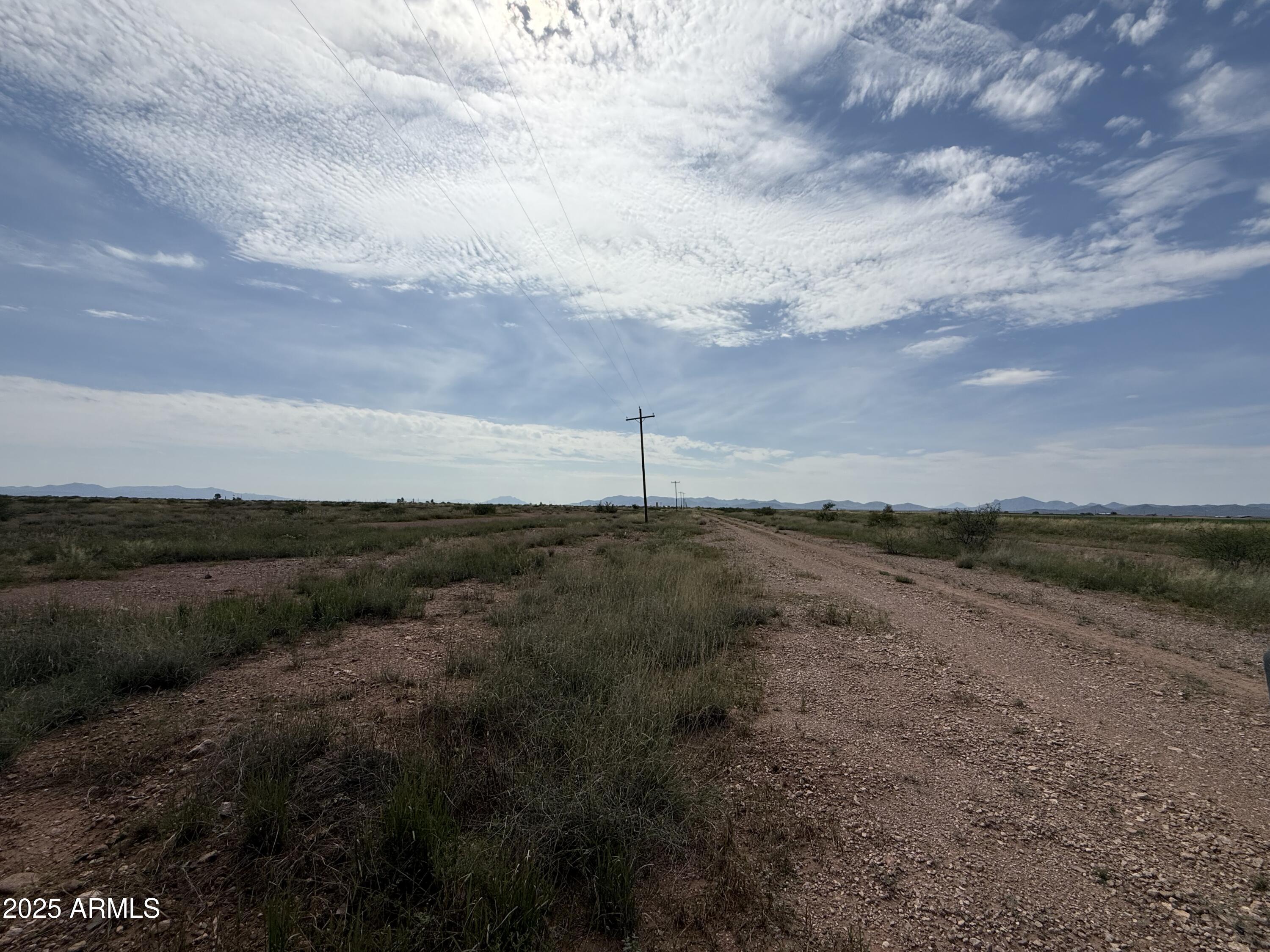 1.39-ac North Old Brooks Road, Unit 964 Douglas, AZ 85607 - Photo 7 of 12 a view of a dry yard with wooden fence