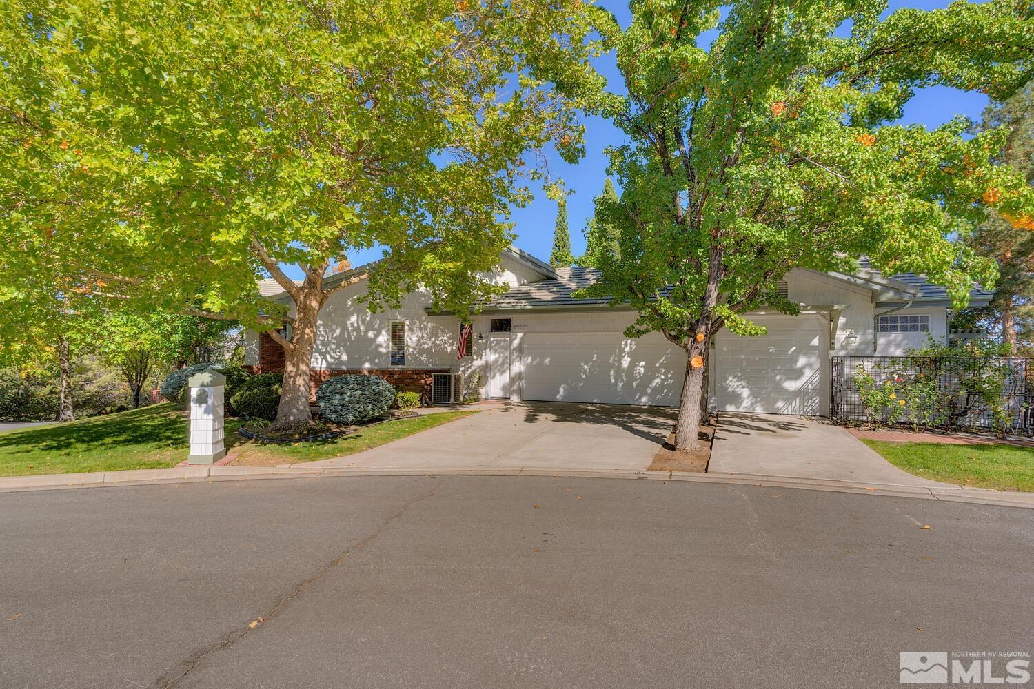 3480 Cranbrook Circle Reno, NV 89519 - Photo 1 of 22 a big house with trees in front of it