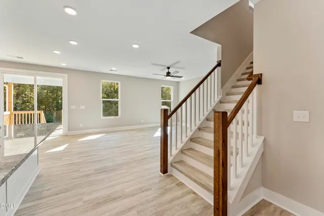 a view of entryway with wooden floor and stairs