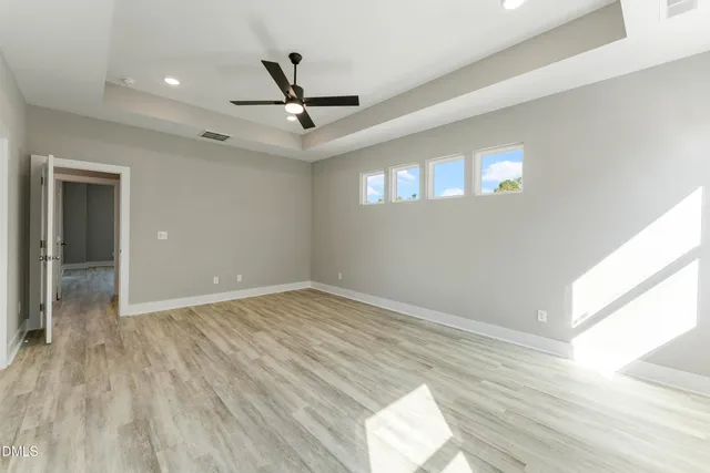 a bathroom with a granite countertop sink mirror and shower