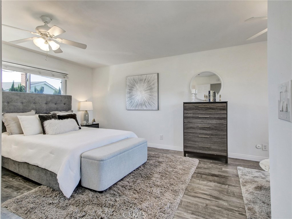17815 Lysander Drive Carson, CA 90746 - Photo 21 of 24 a bedroom with a bed and a chandelier