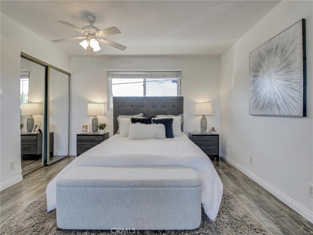 17815 Lysander Drive Carson, CA 90746 - Photo 22 of 24 a bedroom with a bed and a chandelier