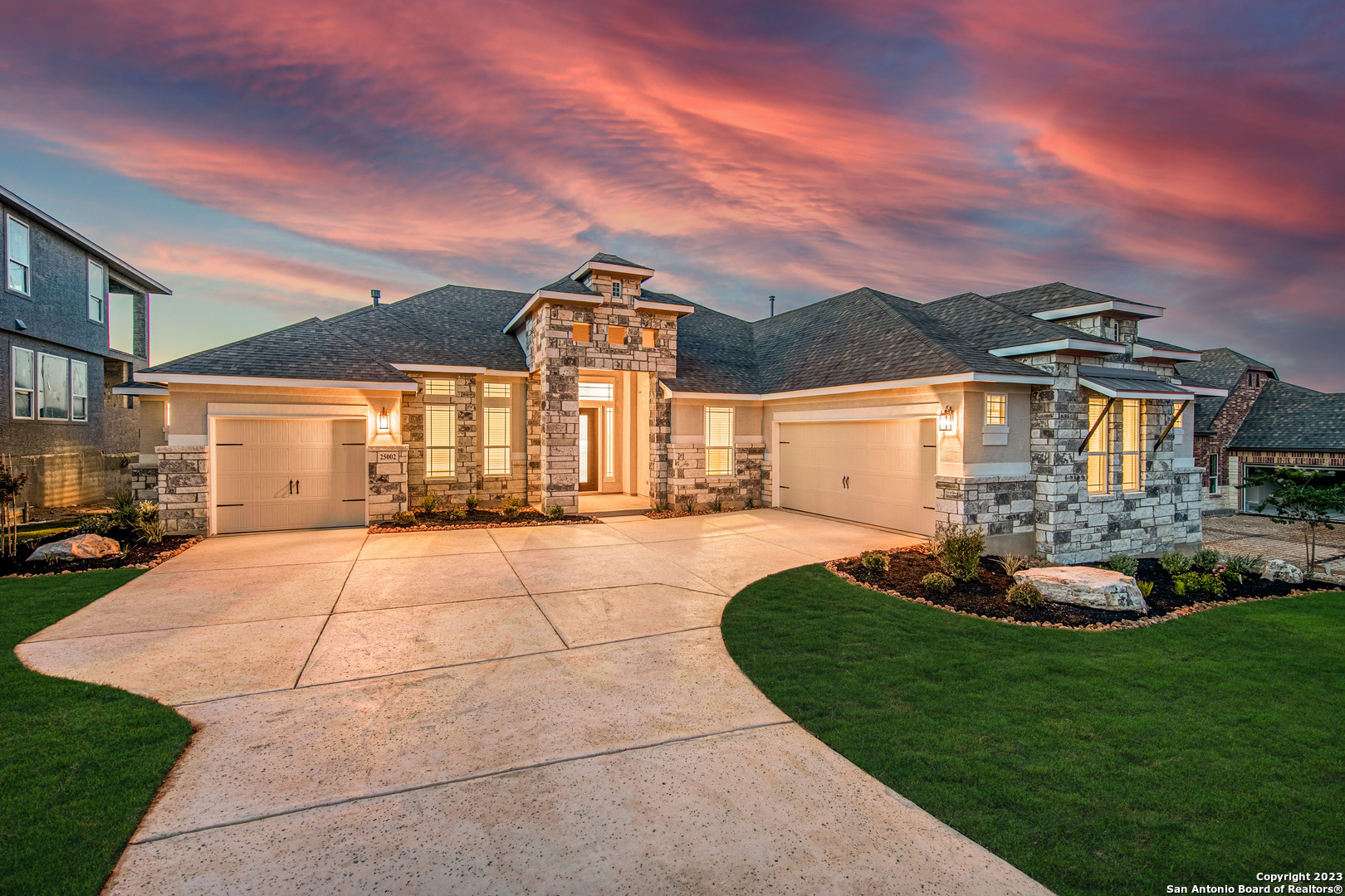 a front view of a house with a yard